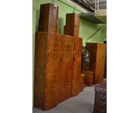 A good quality Art Deco burr walnut four piece bedroom suite comprising of a triple door wardrobe, double door wardrobe, doub