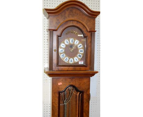 A reproduction figured walnut grandmother clock, having a glazed trunk door with pendulum and three weights