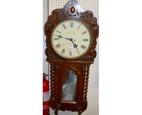 An early 20th century moulded oak drop trunk wall clock, the white enamel dial signed J Hewlett, Cheltenham