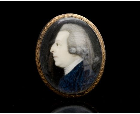 A portrait miniature of a gentleman in profile, circa 1790, on ivory mounted behind crystal, framed in rose coloured metal, h