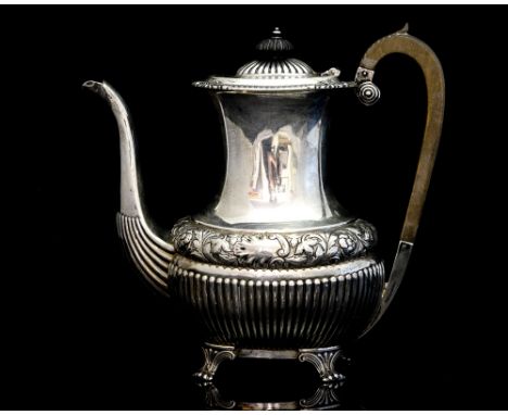 A Victorian silver coffee pot, with a central banding of embossed rococo scroll, floral and foliate decoration, with fluting 