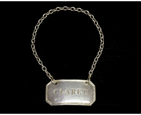 A George III English provincial silver wine label or bottle ticket, of canted rectangular form, incised 'CLARET', with chain,