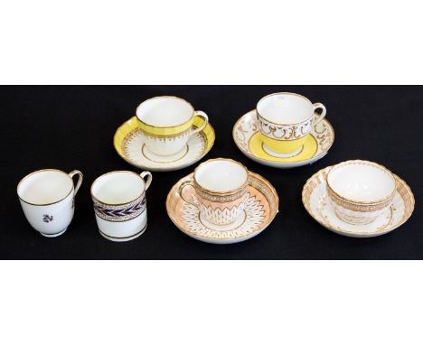A collection of 18th century Derby porcelain including four cups and saucers in yellow and pink gilt decoration, some fluted,