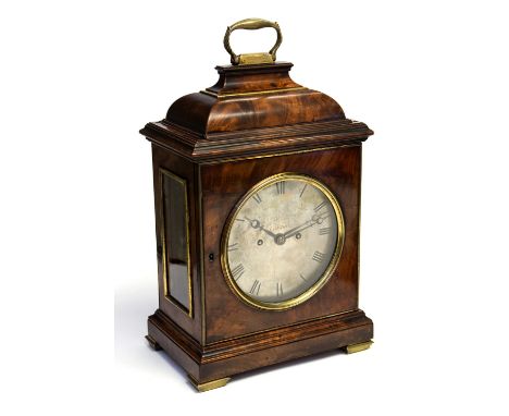 A George III flame mahogany Thwaites & Reed bracket clock, brass swing handle, caddy top, glazed 16cm circular silvered brass