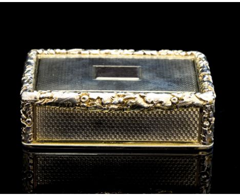 A William IV silver gilt snuff box, of rectangular form, the exterior with engine turned decoration and applied cast foliate 