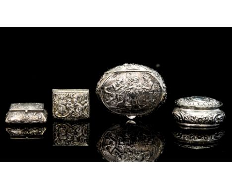 A Continental snuff box, oval with embossed tavern scene, Chester import mark for 1913, together with two imported silver pil