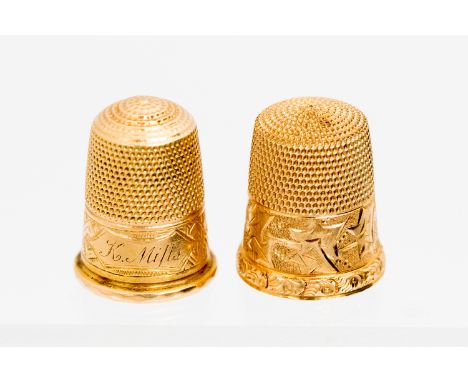 A Victorian gold thimble chased with foliage, together with another Victorian 15ct gold thimble with cartouche inscribed “K M