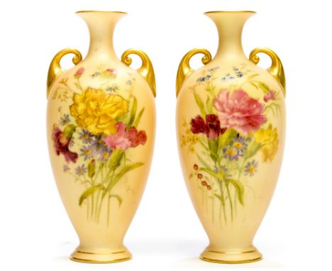 A pair of Royal Worcester blush ivory twin handled bottle vases, date cypher for 1911, florally decorated, gilt detailing, sh