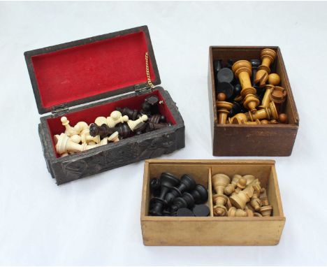 Three various chess sets including an early 20th century ebony and ivory Staunton pattern example, together with a wooden Sta