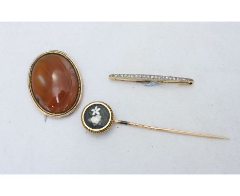 Three yellow metal (test as 14ct gold) items, including a bar brooch set with graduated rose cut diamonds, a stick pin and an