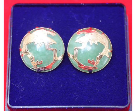 A pair of 9ct gold and jade earrings, decorated with dragons. Gross weight of pair approximately 7.9g
