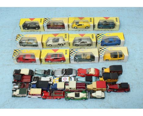 A collection of various scale model toy cars, including ones by Maisto, Lesney, Matchbox and Lledo, some boxed