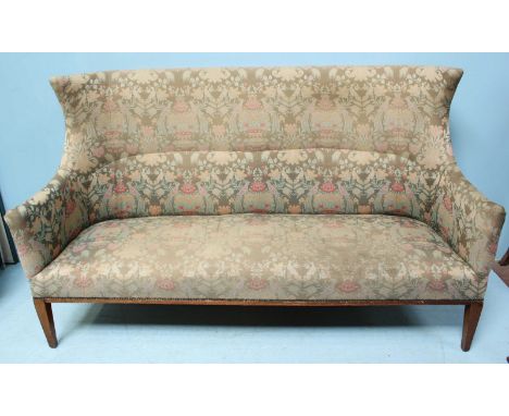 An Edwardian high-back three-seat sofa, upholstered in William Morris 'style' green satin worked with flowers and birds, the 