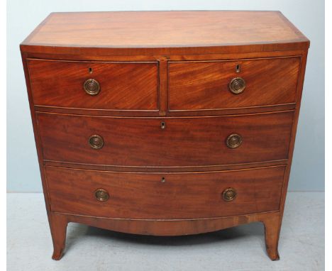 An early 19th century bow-front mahogany chest of two short and two long drawers, on splayed bracket feet, 90cm