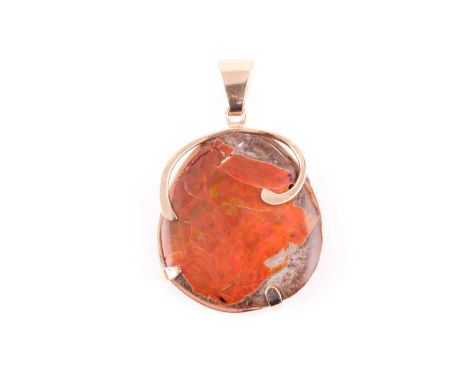 An unusual 9ct yellow gold mounted matrix opal, the boulder and opal resin bound, showing strong orange and green colour to s