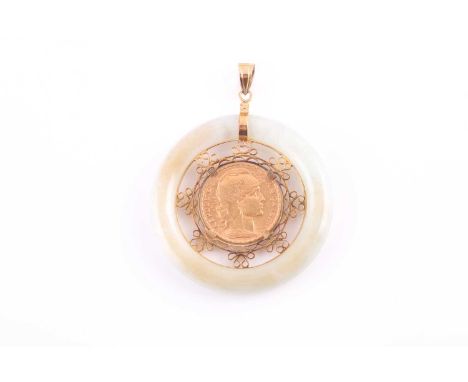 A yellow metal and jade pendant, the pale green bi pendant with 14k mount and interior, set with a yellow gold 20 franc coin 