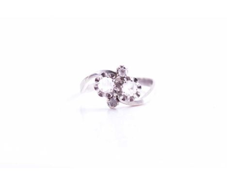 An 18ct white gold and diamond crossover ring, set with rose-cut diamonds, the two larger diamonds approximately 3.5 mm diame