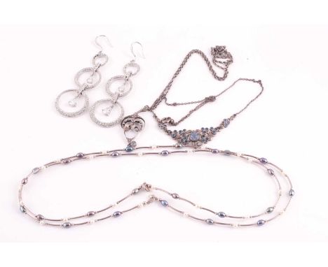 An Art Nouveau silver and paste pendant and chain; another paste necklace; a pair of circular pendant earrings and a two colo