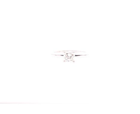 An 18ct white gold and solitaire diamond ring, set with a round brilliant-cut diamond, approximate colour / clarity H/I, SI1,