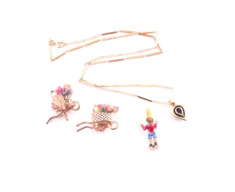 A pair of novelty floral wheelbarrow clip earrings, together with a novelty Pinocchio yellow metal and enamel pendant, unmark