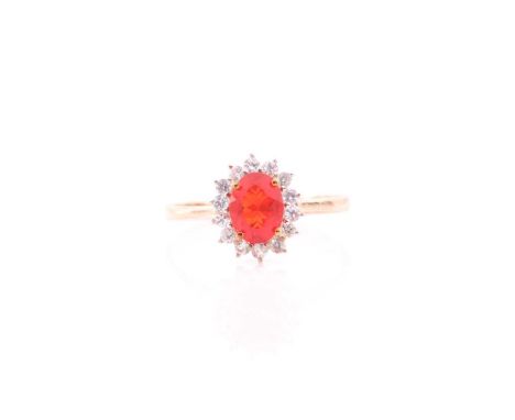 A 9ct yellow gold, fire opal, and white topaz cluster ring, the opal measuring approximately 8.2 x 6.2 mm, size W (could be r