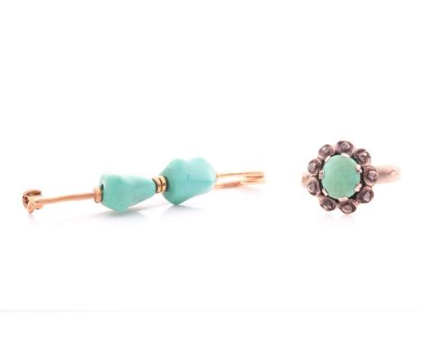An antique turquoise and rose diamond cluster ring;  with central,l oval claw set plaque within scalloped foliate border set 