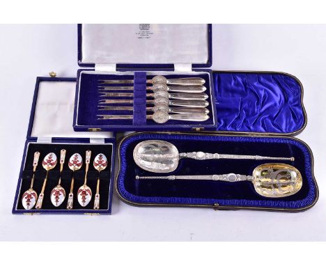 A cased pair of large Victorian silver and parcel-gilt anointing spoons, London 1897 by Wakely &amp; Wheeler, 26 cm long, tog