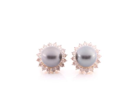 A pair of Tahtian pearl and diamond earrings, the grey pearls in cup mounts above a border of claw mounted round brilliant cu