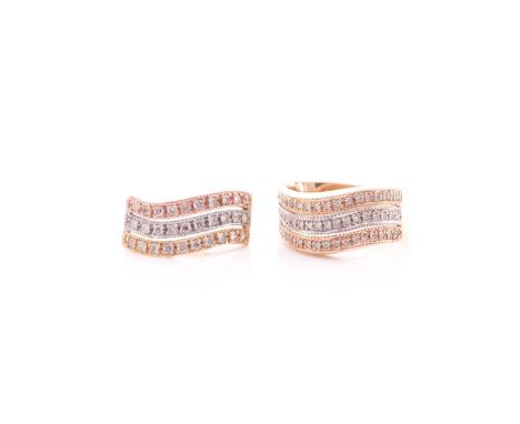 An Italian bi-coloured diamond ring and pendant en suite, comprising three rows of circular cut diamonds with beaded channel 