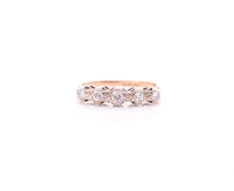 A five stone half hoop diamond ring; the graduated mixed old brilliant cut stones in carved claw mounts to plain shank. Size 