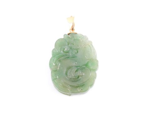 A Chinese green jade pendant, with carved and pierced swirled decoration, suspended on a yellow metal loop, jade approximatel
