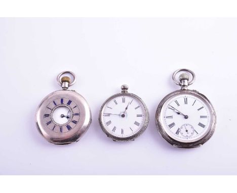 A group of three silver pocket watches, including a half hunter example, all with white enamel Roman numeral dials. (3)