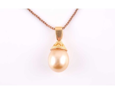 A yellow metal and South Sea pearl pendant necklace, set with a golden pearl, (the unmarked mount tests as 18ct gold), pendan