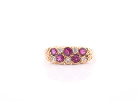 An 18ct yellow gold, diamond, and ruby ring, rubover set with mixed round-cut rubies and old-cut diamonds, size O.Condition r