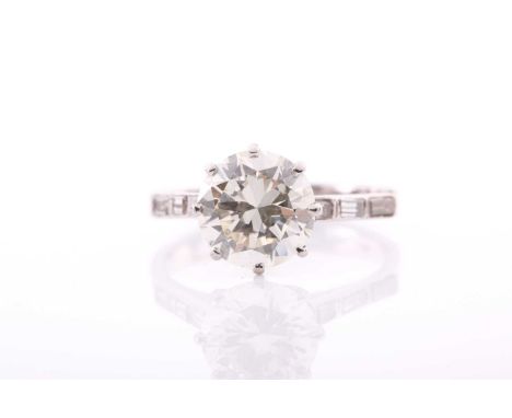 A solitaire diamond ring, the round brilliant-cut diamond measuring approximately 3.20 carats, approximate colour and clarity