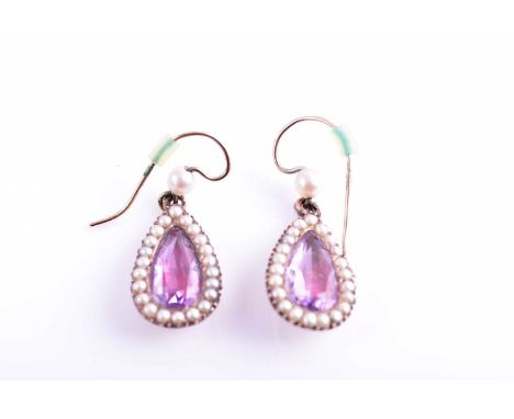A pair of Victorian pearl and amethyst drop earrings, each with a closed-back set pear-cut amethyst within a border of split 
