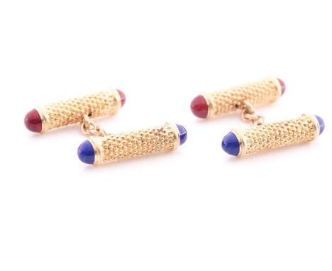 A pair of yellow metal textured baton cufflinks, with blue and red enamel terminals, indistinct marks to chain loops.Conditio