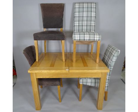 A modern light oak draw leaf dining table, L120cm, H79cm, D90cm, and 4 matching dining chairs 