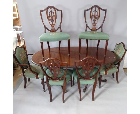 A reproduction mahogany D-end dining table, with 2 spare leaves, 178cm extending to 270cm x 75cm x 107cm, and 8 matching tape