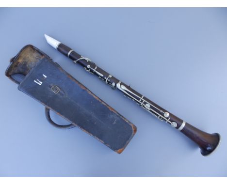 A 19thC clarinet by Buffet, Crampon &amp; Cie, Paris, with Boosey &amp; Hawkes ivorine mouthpiece, 25" overall, in leather ca