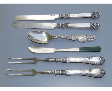 A pair of Australian art nouveau silver-handled two-prong forks, a New Zealand jade-handled  Sterling silver butter knife, a 