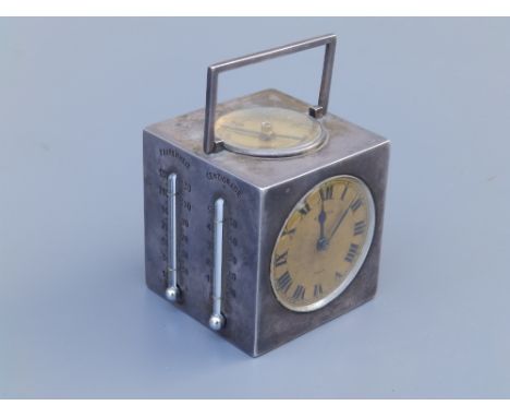 A Hermes five-sided multi-function cube travelling clock, having  barometer &amp; compass dials, thermometers in Fahrenheit &