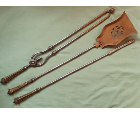 A three piece Victorian set of fire tools, in steel with brass handles, 30".