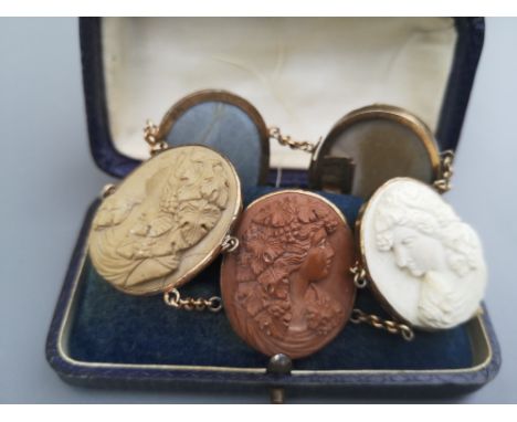 A late Georgian/early Victorian lava ware bracelet,  formed from five large oval Bacchanalian female portrait busts  in high 