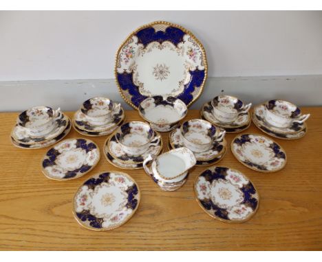 25 pieces of Coalport royal blue ground 'bat wing' tea china, comprising a bread &amp; butter plate (later marks), sugar bowl