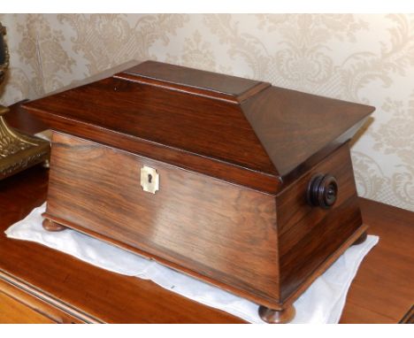 A plain Victorian rosewood sarcophagus shaped tea caddy, 14" across.