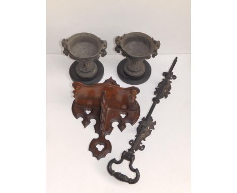 A small Victorian Gothic revival walnut wall bracket decorated pierced trefoils, 12.5" high, a pair of Gothic style pewter ur