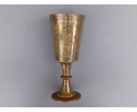 A 19thC Indian engraved brass goblet, having black enamelled panel decoration depicting figures &amp; animals within arabesqu