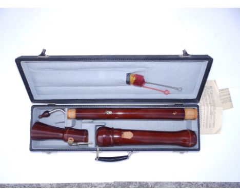 A modern German bass recorder, 33" with crook in case, together with a triangular three-string mandolin, 27" overall. (2)