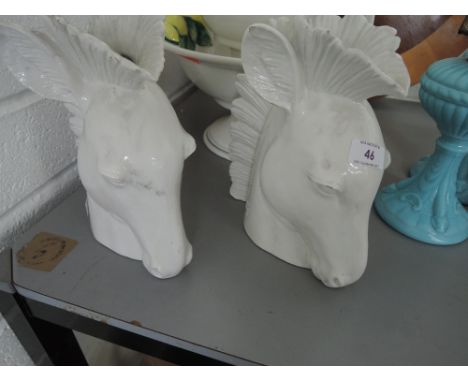 Two ceramic vases in the form of horse heads